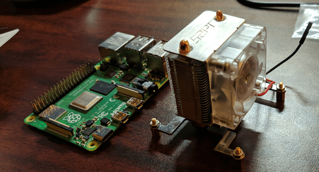 raspberry pi 4 massive fan side by side with a raspberry pi